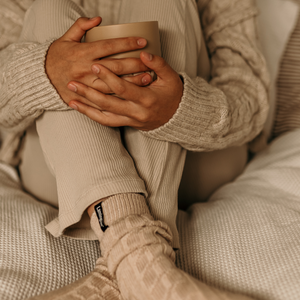 woman wearing merino wool luxury cable knit socks nz