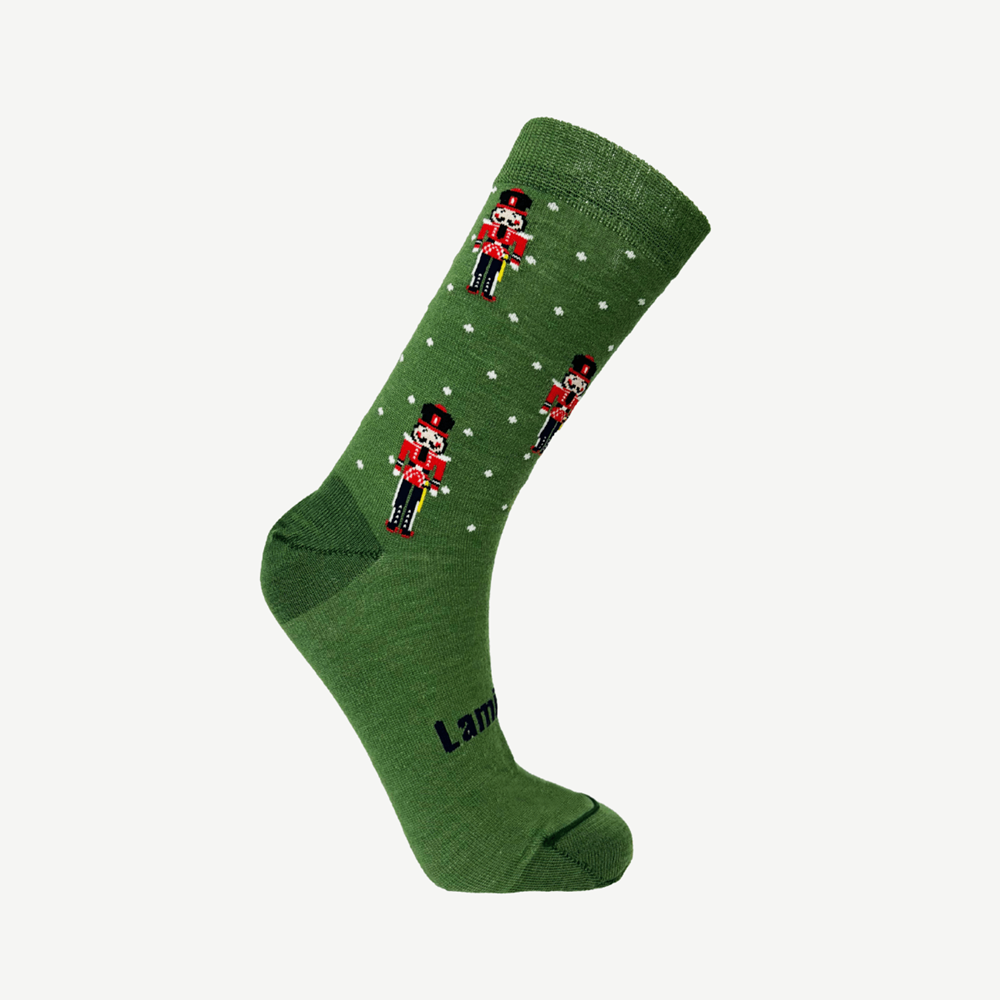 Green sock with white spots with nutcracker design