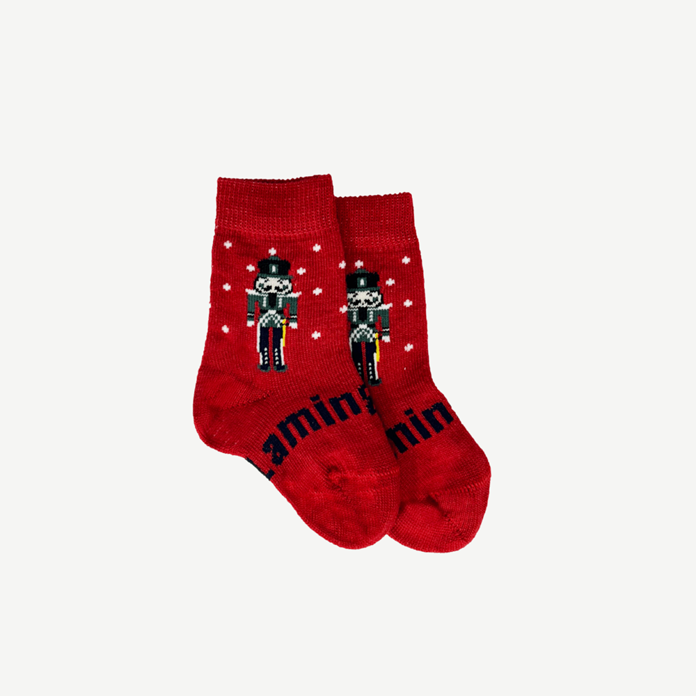 Red socks with white spots with a nutcracker design